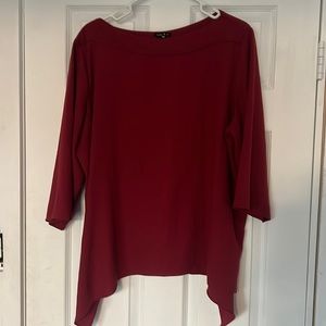Loose fitting blouse with boat neckline
